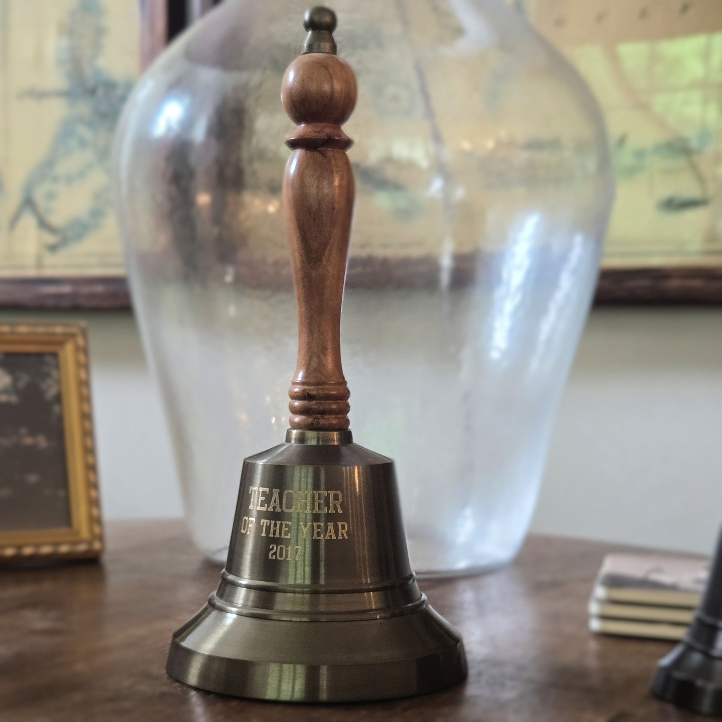 Antiqued brass hand bell with Teacher of the Year engraving